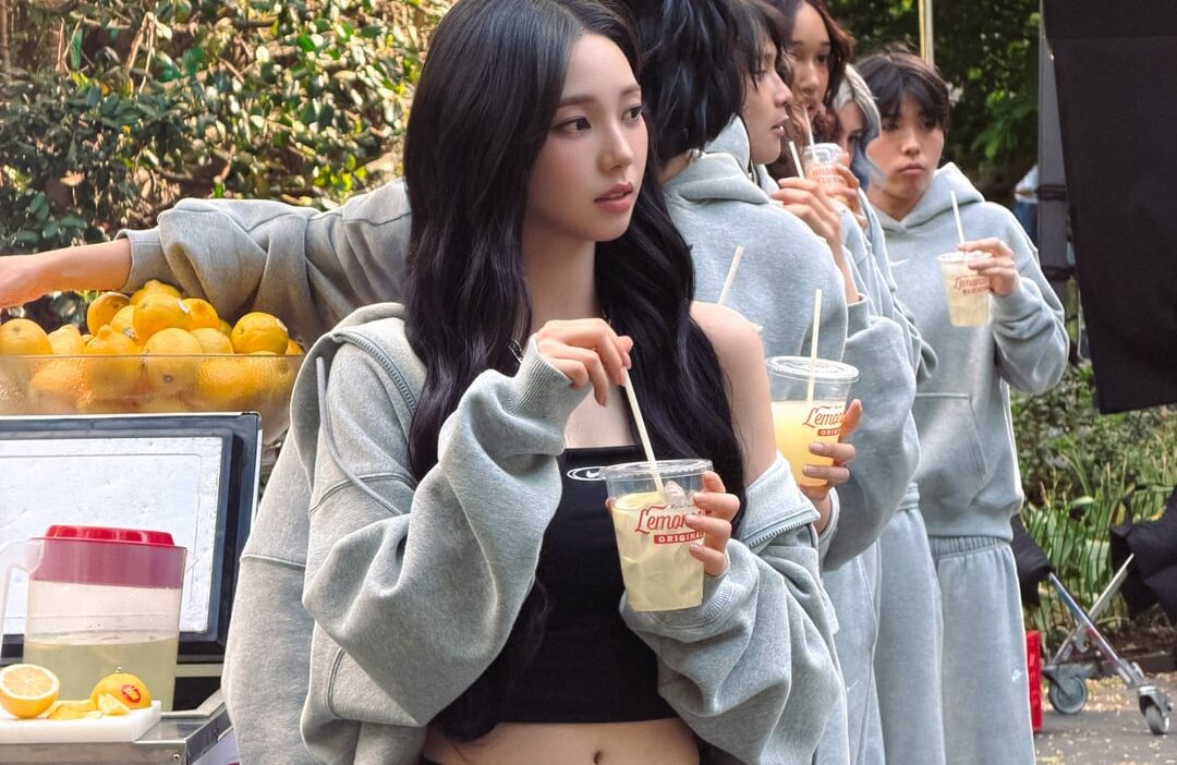 260731 Karina serving lemonade on set for Nike Studio Fleece